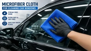blue microfiber cloth for cleaning car windows during auto detailing process