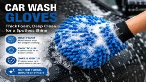 Car wash gloves covered in thick foam soap while deep cleaning a vehicle surface