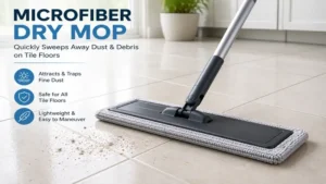 Microfiber dry mop sweeping dust and dirt from a smooth tile floor without scratching the surface