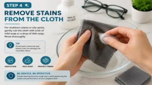 How do you clean eyeglass cloths and remove stubborn stains or oily spots without damaging the cloth